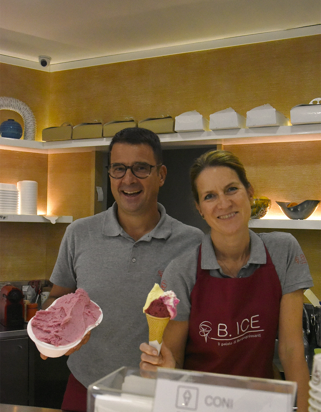The couple, Aldo and Cristina, pouring gelato for clients at their gelateria B.ICE in Florence