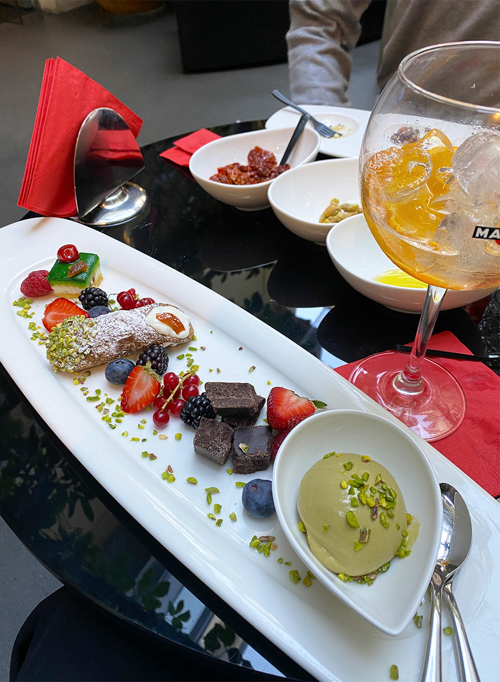 Aperitivo time in Italy: plate with Sicilian dessert