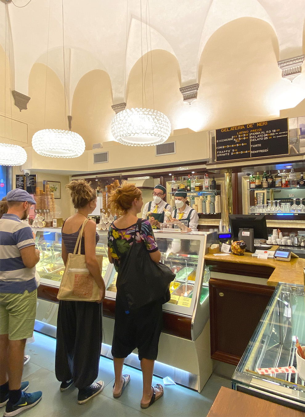 Clients queue waiting for their scoop at the gelateria Dei Neri in Florence 